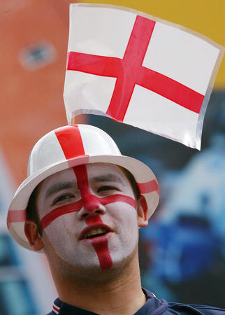 An England fan watches his team's World Cup Finals match against Sweden on a big screen in Manchester city centre June 2, 2002. England drew the match with Sweden 1-1.