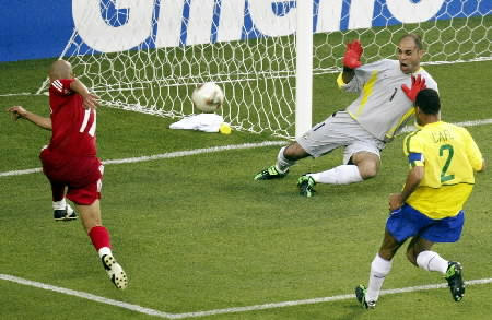 Turkey's Hasan Sas (L) scores past Brazil's goalkeeper Marcos (C) as team mate Cafu tries to defend during their World Cup match in Ulsan June 3, 2002. 