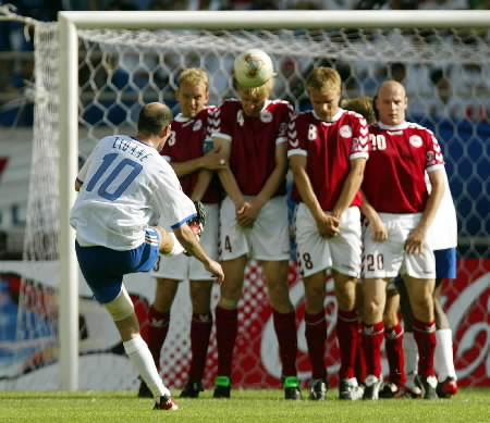 Zinedine Zidane is pictured shooting a free kick as Denmark's (L-R) Stig Toften, Martin Laursen, Jesper Gronkjaer, Kasper Bogelund and Thomas Gravesen try to block it