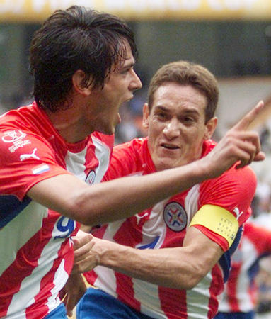 Paraguay's Roque Santa Cruz (L) celebrates his goal against South Africa with team captain Carlos Gamarra during their group B World Cup Finals match in Pusan June 2, 2002