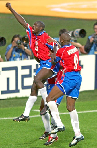 Costa Rica's Winston Parks, left celebrates his goal against Turkey with his teammate Paulo Wanchope during their Group C World Cup 2002 soccer match at the Incheon Munhak Stadium in Incheon, South Korea, Sunday, June 9, 2002. The game ended 1-1