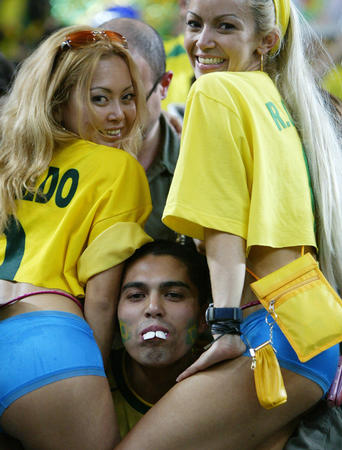 Brazil soccer fans celebrate their team's victory over Turkey in a World Cup semi-final match in Saitama June 26, 2002.