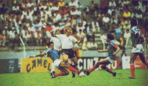 Karl-Heinz Rummenigge is tackled by Manuel Amoros and Michel Platini in the semifinal which was a replay of the classic encounter four years earlier. The 1986 match ended with the same winner, but had nothing of the same excitement and drama. 2-0 was the final score. 