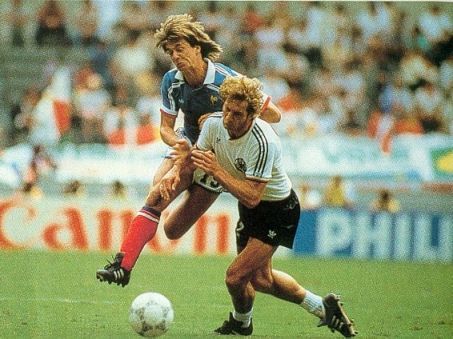 Physical battle in the France v West Germany semifinal. Yannick Stopyra (left) and Dietmar Jakobs.