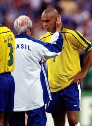 Brazil coach Mario Zagallo tries to comfort star player Ronaldo after Brazil lost in the championship of the World Cup on Sunday, July 12, in Paris. Ronaldo convinced team officials to let him play with a sprained ankle, but his presence couldn't keep France from taking a 3-0 victory over the defending champions.
