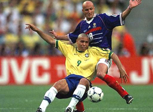 Ronaldo of Brazil (9) is challenged from behind by Frank Leboeuf of France during the final of the soccer World Cup 98 between Brazil and France at the Stade de France in Saint Denis, north of Paris, Sunday, July 12, 1998.
