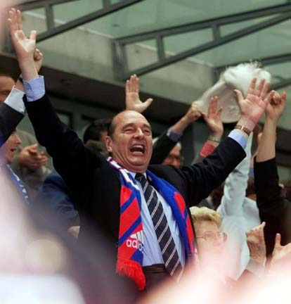 France president Jacques Chirac raises his arms in celebration of a French goal during the World Cup championship game on Sunday, July 12. Chirac was on hand to see France beat defending champion Brazil 3-0 and become the first host team to win the World Cup in 20 years.