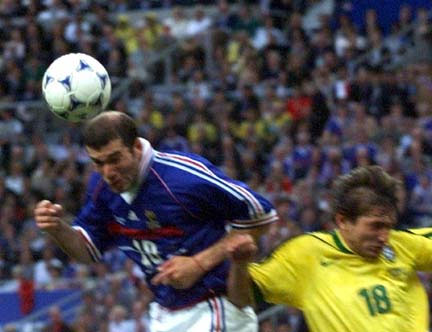 The blurriness of this picture shows how quickly France's Zinedine Zidane got into postion to score the opening goal of the World Cup championship game with this header on Sunday, July 12, in Paris. France never trailed after the goal, going on to beat Brazil 3-0.