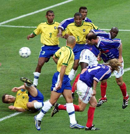 France's Zinedine Zidane heads home his second goal of the World Cup championship game on Sunday, July 12, in Paris. Zidane's two goals, both headers, sparked France to a 3-0 victory over defending champion Brazil.